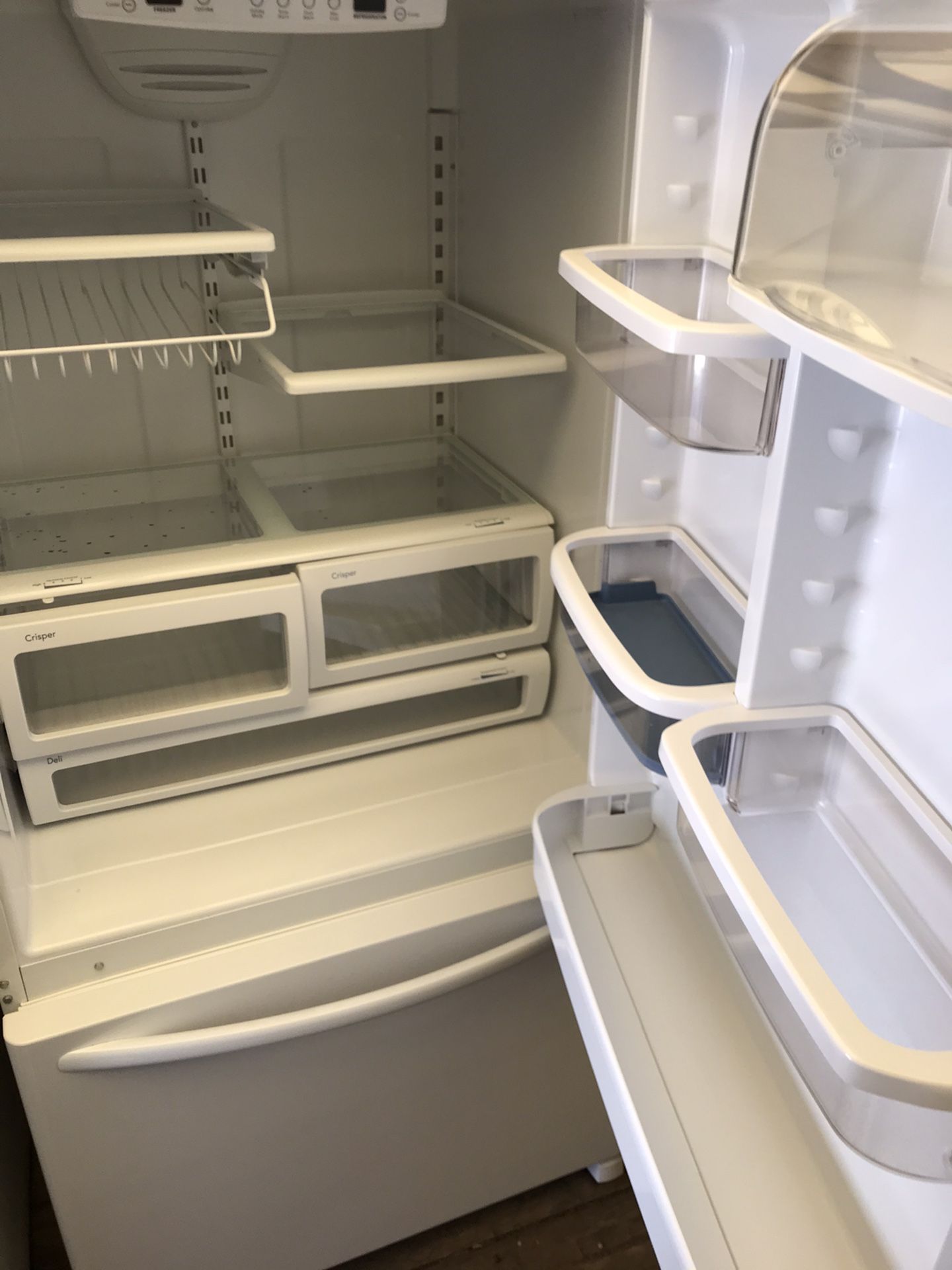 Glossy white Kitchenaid bottom freezer refrigerator