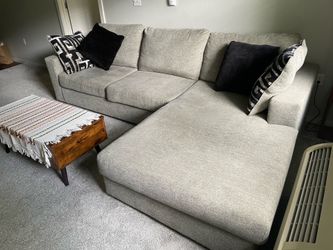 Sectional sofa with full sleeper