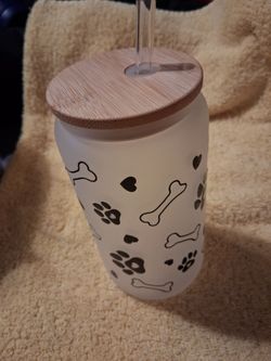 White tumbler with black bone and paw print graphics