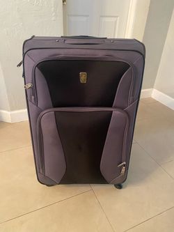 TravelPro Expandable Checked Luggage