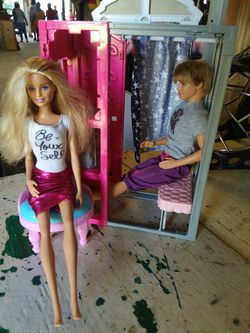 2 dolls and chair and photo booth