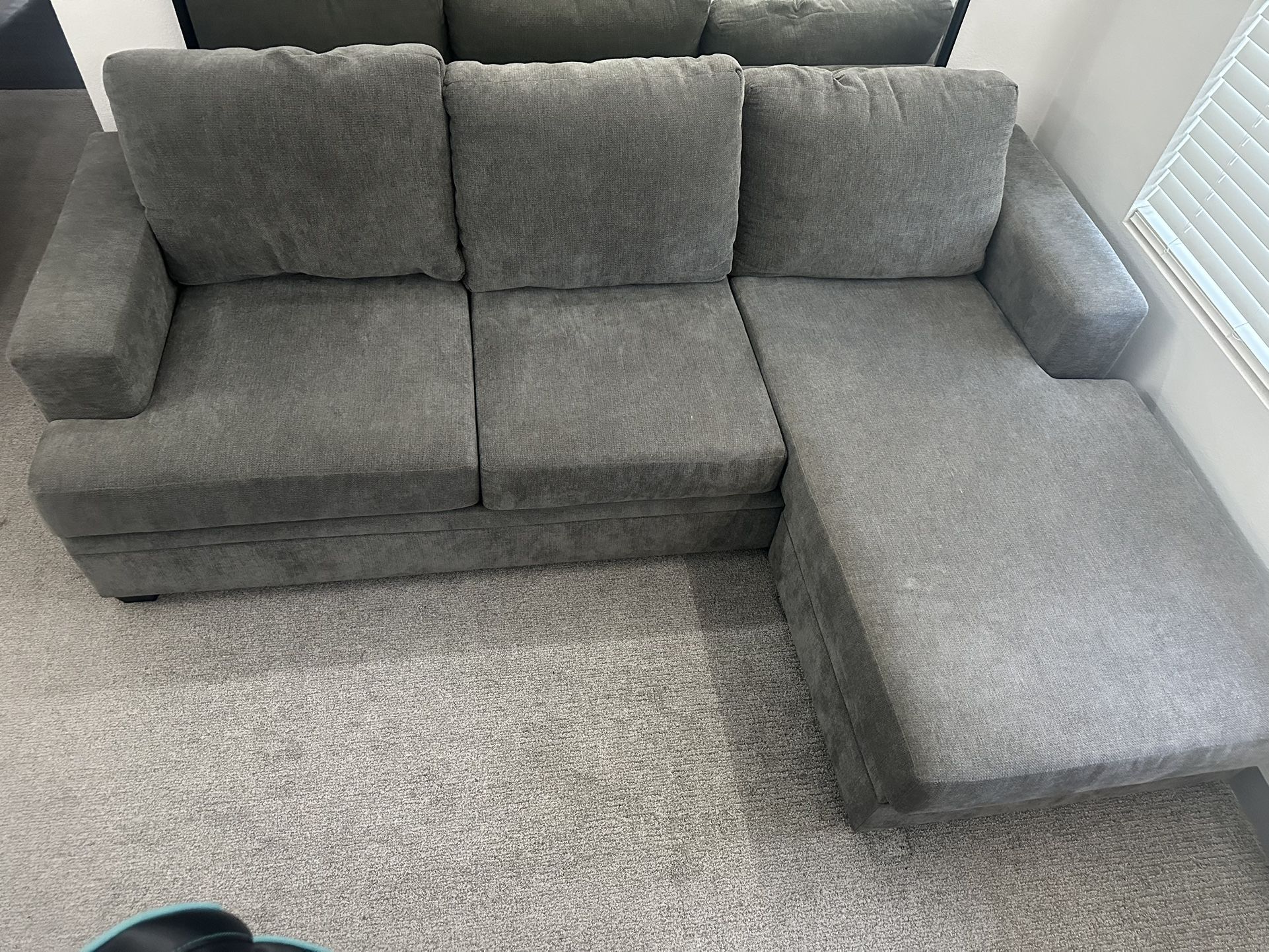 Living Spaces Grey Couch Retails $1000