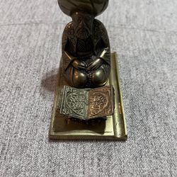 A vintage brass middle eastern scholar sculpture. 