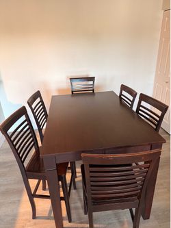 Height dinner table with six chairs