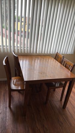 Table and four chairs good shape except for discoloring on top.