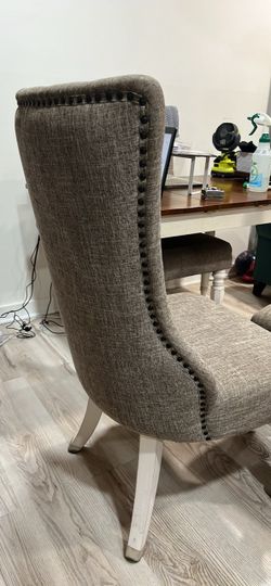 Gray Upholstered Wingback Chair with Nailhead Trim
