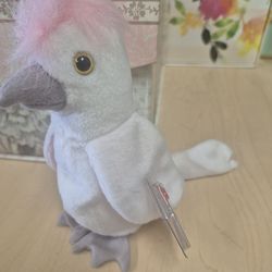 Ty Beanie Baby plush toy named Kuku the Cockatoo.