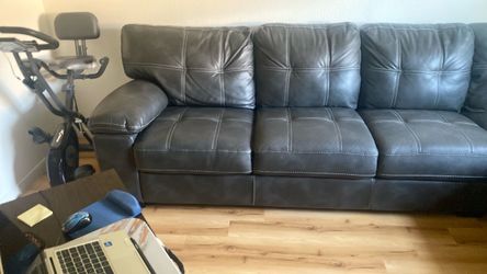 Gray Leather Sofa with Tufted Cushions