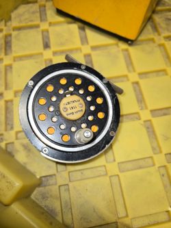 Fly fishing reels and rods