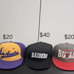 collection of three snapback caps