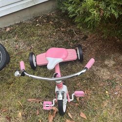 Radio flyer pink tricycle.