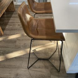 WEST ELM real genuine saddle vegan leather matching high bar stools (floor to seat: 30”).  In great used condition. Price is for both. 