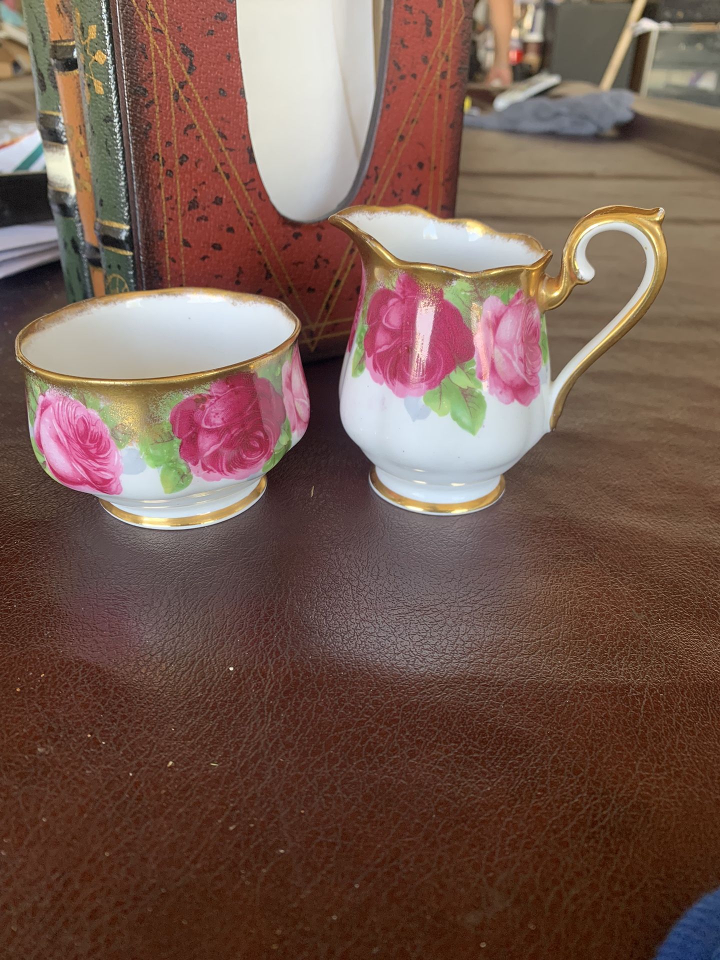 This beautiful reaper and sugar set is old English Rose Royal Albert bone china. Made in England. The sugar bowl measures 2.25 inches tall and is 3