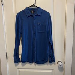 This is a Volcom Men's Caden long-sleeve button-down shirt in blue