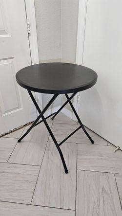 New 24 inch round folding table. 29inch tall