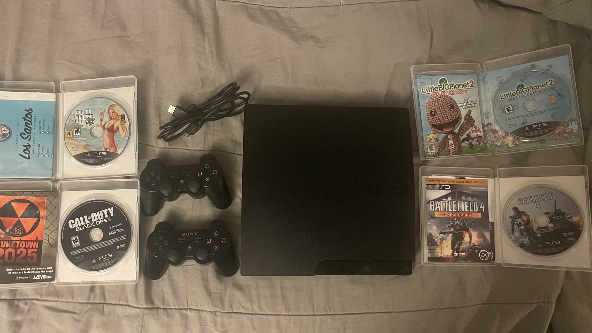 PS3 w/ 2 Controllers + 4 Games