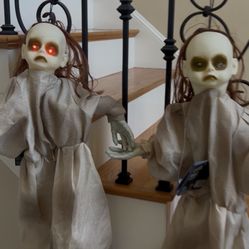 S/2 Laughing Dolls with Eyes Blinking.   New 