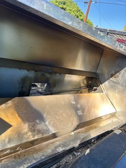 Durable stainless steel exhaust hood is manufactured by Wood Stone. This commercial-grade unit has a metallic silver finish and includes internal pipi