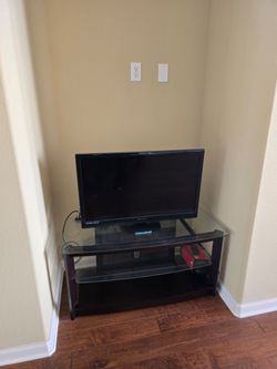 Glass tv stand with tv