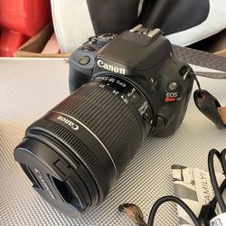 Canon EOS Rebel SL1 Digital. Rokinon 35mm f/1.4 Lens for Canon Cameras. With accessories and bag