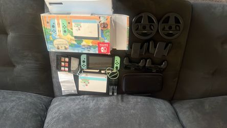 Nintendo switch limited edition animal crossing with controller charger 6 games the box and cables to connected to the tv and with all extra stuff onl