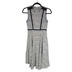 H&M sleeveless, midi-length dress featuring a black and white animal/cheetah print pattern.