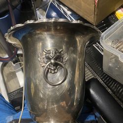 Poole & Silver company Silver Plate wine bucket with lions head handles. Excellent condition estimated value $350 Delivery available 