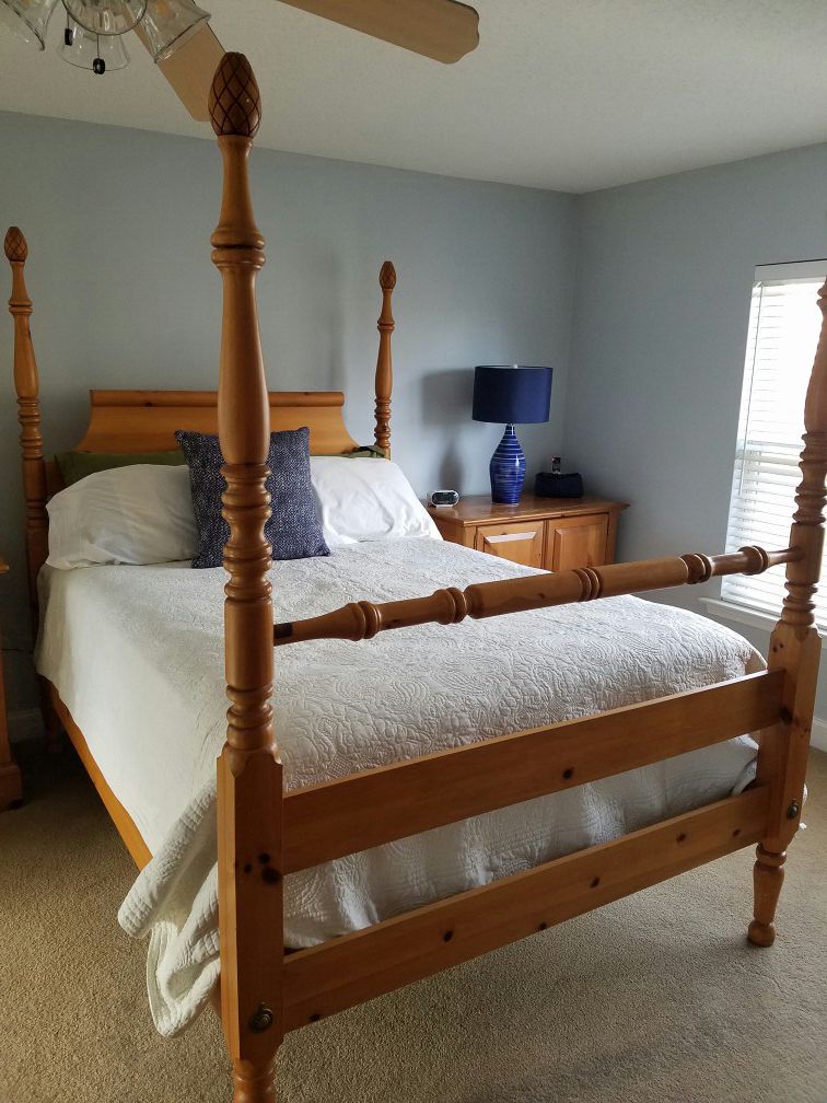 Queen bed frame includes headboard and footboard