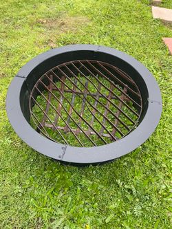 Wrought iron fire pit solid  - Fire pit with grill is iron and the liner - liner is 33.5  inches wide 10 inches high