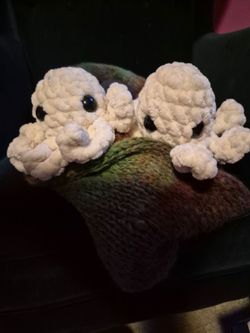 Handmade knitted scarf with octopus pom-poms