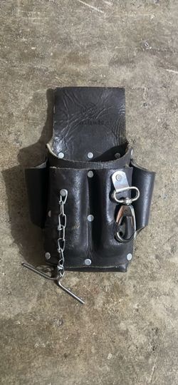 Southwire POUCH4: A 5-pocket leather pouch with an electrical tape chain