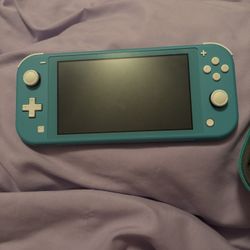 Teal Nintendo Switch Lite w/ matching animal crossing case & animal crossing game