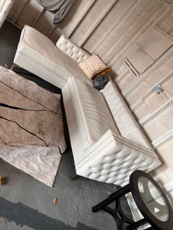 White leather sectional with 2 chairs