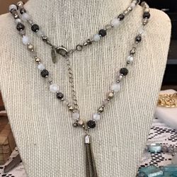 New York ladies this is for you a beautiful black white and beige beaded necklace Tag says NY