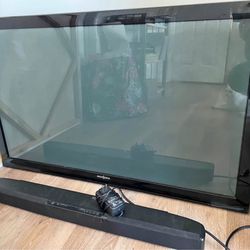 Flat screen Tv W/ Sound bar And Back Hooks To Hang On Wall