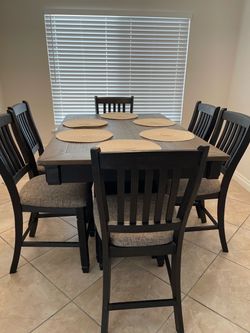 Bar height dining table