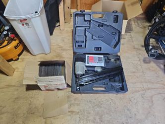 Porter-Cable framing air nailer with box of nails