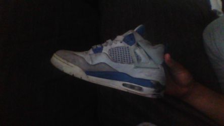 two jordan fours one is millatary blue and the other is olive green