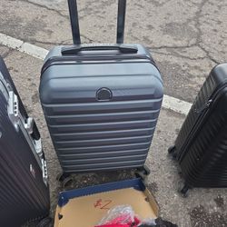 Like new Delsey Green and Gray Carry-on Luggage. From Costco.