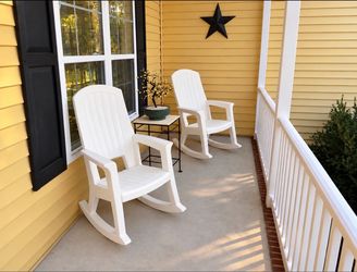 I have two very heavy duty white resin rocking chairs. These sell for $169 each and can hold up to 600 pounds each, with high backs, wide armrests an