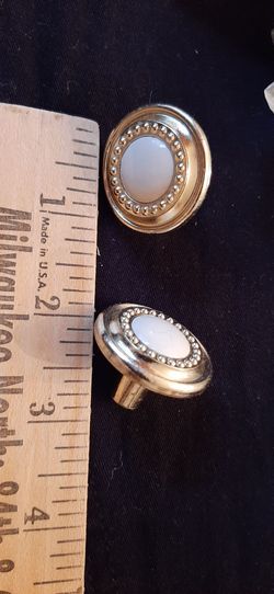 Cabinet Knobs Gold finish a beige/ cream colored center