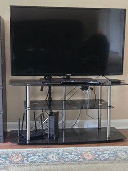 Samsung Smart TV + TV stand + Roku