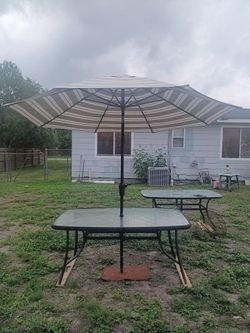 Beautiful patio table with 9 ft sunbrella