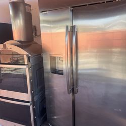 Monogram 48 refrigerator , Monogram 36 extractor hood, like new, double oven, 36 stove, and wine cooler