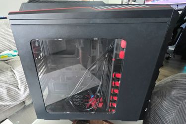 DIYPC Skyline-06-WR ATX Full Tower Gaming Computer Case in black and red.