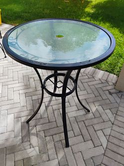 Outdoor patio table. 34H 27W. Have a small rust