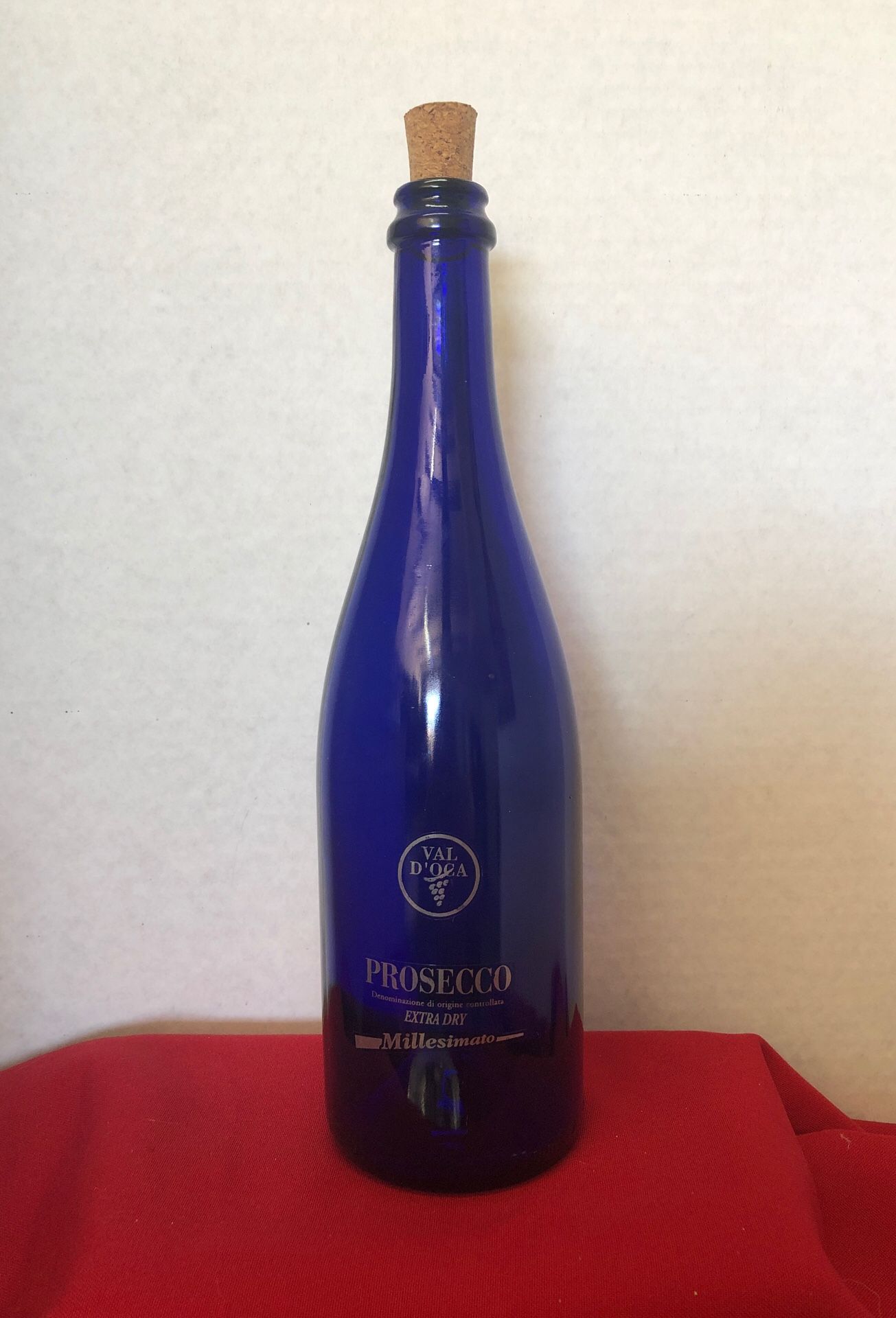 Empty Prosecco blue bottle