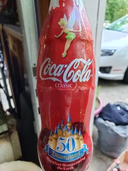 9 different Disney coke bottles