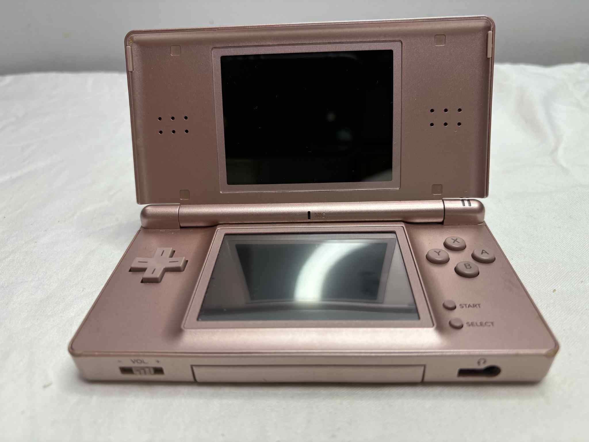 Nintendo DS Lite in a bronze or rose gold color.  