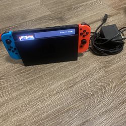 Nintendo Switch With Remotes, Chargers And Games